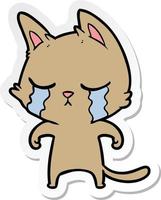 sticker of a crying cartoon cat vector