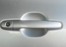 Glassy handle of the modern car. photo