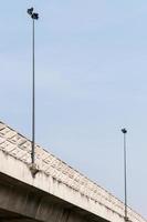 Electrical lamp pole on the express way bridge. photo