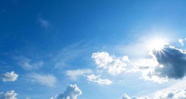 Clean blue sky and white clouds sky background with space for decoration. And used to make wallpaper or bring to work in graphic design. photo