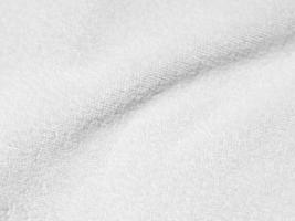 White clean wool texture background. light natural sheep wool. white seamless cotton. texture of fluffy fur for designers. close-up fragment white wool carpet.. photo