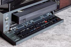 VHS tape in VCR player. photo