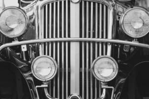 Samutsakhon, Thailand, 2020 - Front headlights with sparkle chrome of the old vintage classic car in black and white style photo