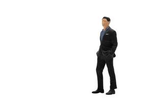 Miniature people businessman wearing black suit with clipping path photo