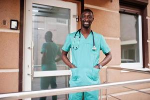 African male paramedic doctor with stethoscope. photo