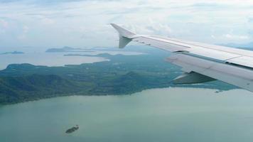 Aerial view over group of island in Andaman sea near Phuket, southern part of Thailand, view from descending airplane video