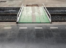 Wooden bridge is cross the railway. photo