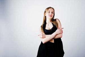 Girl model in black wear posed at studio on white background. photo