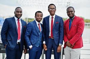 Group of four african american happy succesfull mans at suit. Rich black business mans. photo
