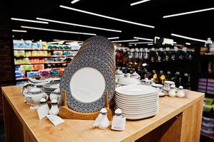 Set of dishes on supermarket shelves for sale. photo