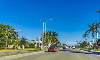 Cancun Quintana Roo Mexico 2022 Typical street road cars buildings and cityscape of Cancun Mexico. photo