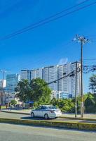 Cancun Quintana Roo Mexico 2022 Typical street road cars buildings and cityscape of Cancun Mexico. photo