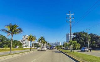 Cancun Quintana Roo Mexico 2022 Typical street road cars buildings and cityscape of Cancun Mexico. photo