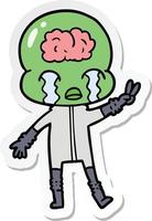 sticker of a cartoon big brain alien crying and giving peace sign vector