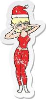 retro distressed sticker of a cartoon woman all ready for christmas vector