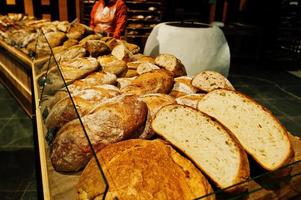 Various bread on supermarket shelves for sale. photo