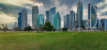 Doha skyline in West bay district daylight view with clouds in the sky photo