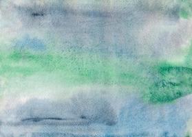 Close-up watercolor water paper texture. Abstract hand-drawing wet brush painted illustration. photo