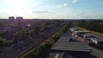 Aerial view of British Town Centre of Luton England with Railway Station and Train on Track video