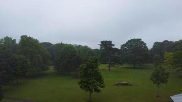 Aerial and High Angle Footage of Local Public Park on a Cloudy Day, Wardown Park is situated on the River Lea in Luton. The park has various sporting facilities, video