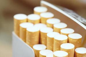 peel it off Cigarette pack prepare smoking a cigarette. Packing line up.  photo filters Natural light. soft focus
