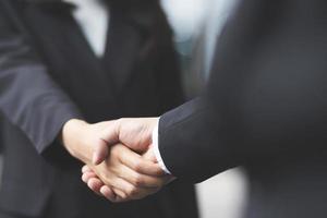 Closeup of a businessman hand shake investor between two colleagues  OK, succeed in business Holding hands. photo