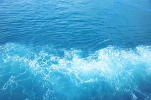 Sea  Waves in ocean wave Splashing Ripple Water. Blue water background. photo