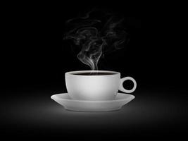 white cup with hot liquid and steam on black photo