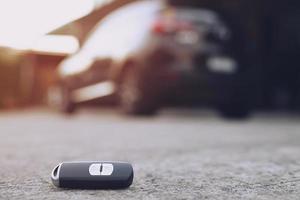 abstract car key fall on the cement ground - can use to display or montage on product photo