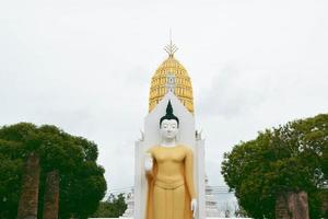 Phra At Throat is standing Buddha statue at Wat Phra Si Rattana Mahathat photo