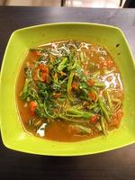 Stir-fried water spinach with Tauco on a melamine plate. Tumis kangkung Tauco. Indonesia Food. photo