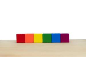 Empty multicolor wooden block on wooden with copy space on white background photo