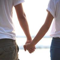 Young couple holding hands photo