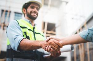 construction workers shaking hands photo