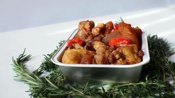 Stir-fried spicy krecek, Indonesian specialties served simply in an aluminum place and a few leaves make the background beautiful photo