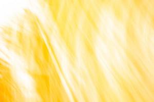 Abstract yellow background banner with scratches, curves and highlights. photo