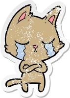 distressed sticker of a crying cartoon cat with folded arms vector