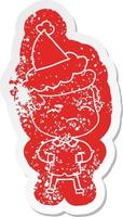 cartoon distressed sticker of a annoyed man wearing santa hat vector