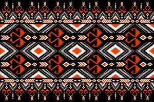 Beautiful embroidery.geometric ethnic oriental pattern traditional on black background.Aztec style,abstract,,illustration.design for texture,fabric,fashion women wearing,clothing,print. photo