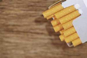 peel it off Cigarette pack prepare smoking. Packing line up put on the wooden table. photo filters Natural light.