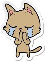 sticker of a crying cartoon cat vector