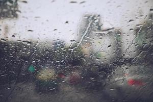 Drizzle on the windshield in the evening. photo