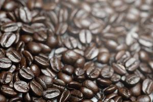photo macro close up texture of roasted coffee beans dark, can be used as a background.