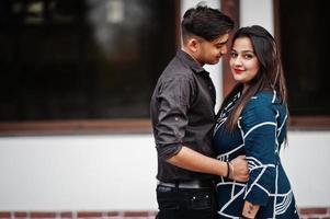 Love story of indian couple posed outdoor. photo