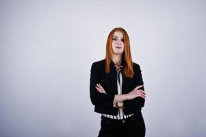 Portrait of a redheaded businesswoman wearing striped blouse and a jacket. photo