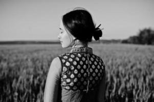 Tender indian girl in saree, with violet lips make up posed at field in sunset. Fashionable india model. photo