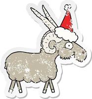 distressed sticker cartoon of a goat wearing santa hat vector