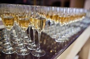 Different alcohol beverages in glasses on the table in restaurant or bar. photo