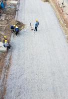 Worker team with the level-measuring instrumen. photo