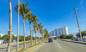 Cancun Quintana Roo Mexico 2022 Typical street road cars buildings and cityscape of Cancun Mexico. photo